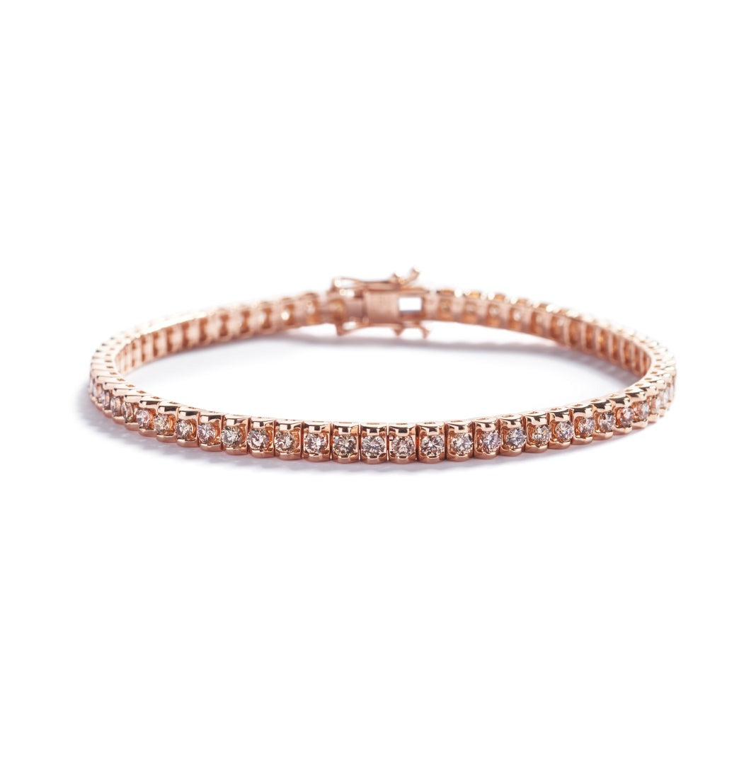 Tennisarmbånd i 18 kt. rosaguld prydet med  64 champagnefarvede C5/VS-SI diamanter, i alt 3,30 ct. 
