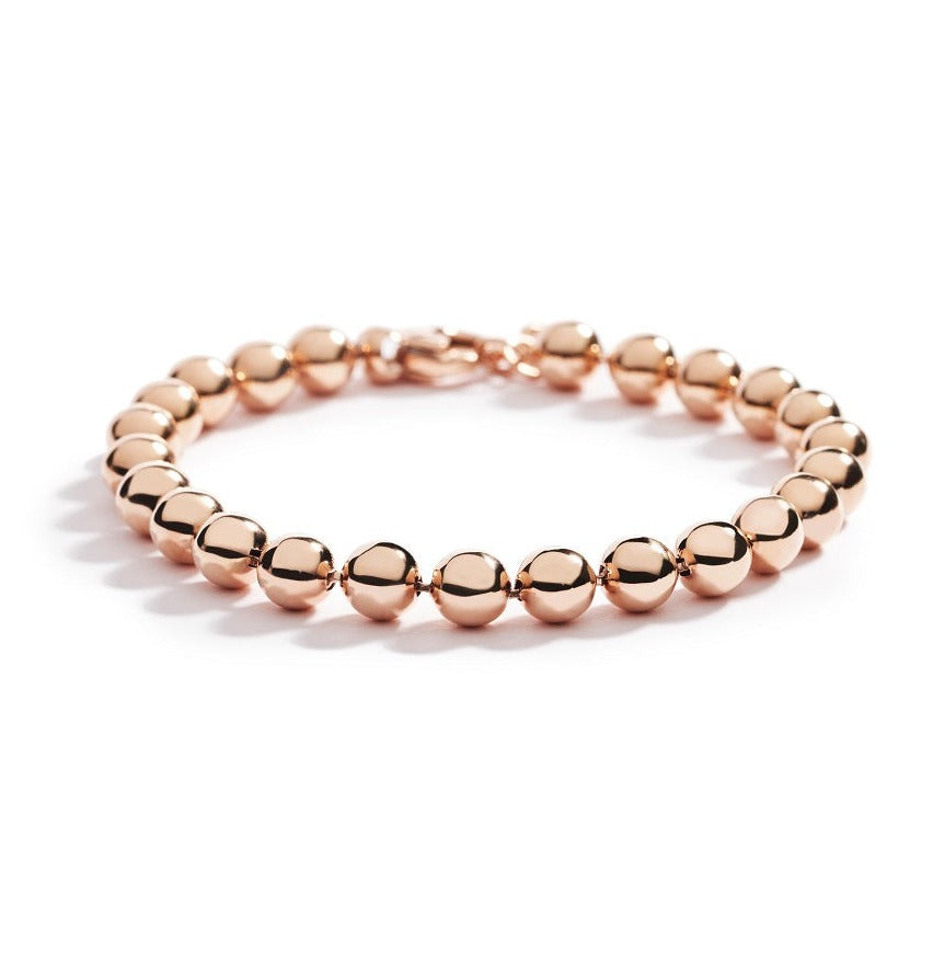 Kuglearmbånd i 18 kt. rosaguld.  Armbåndet findes også i 18 kt. hvidguld og 18 kt. gulguld. 